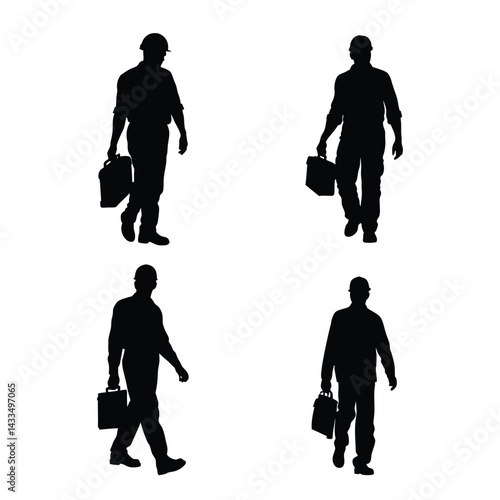 A silhouette of a construction worker walking