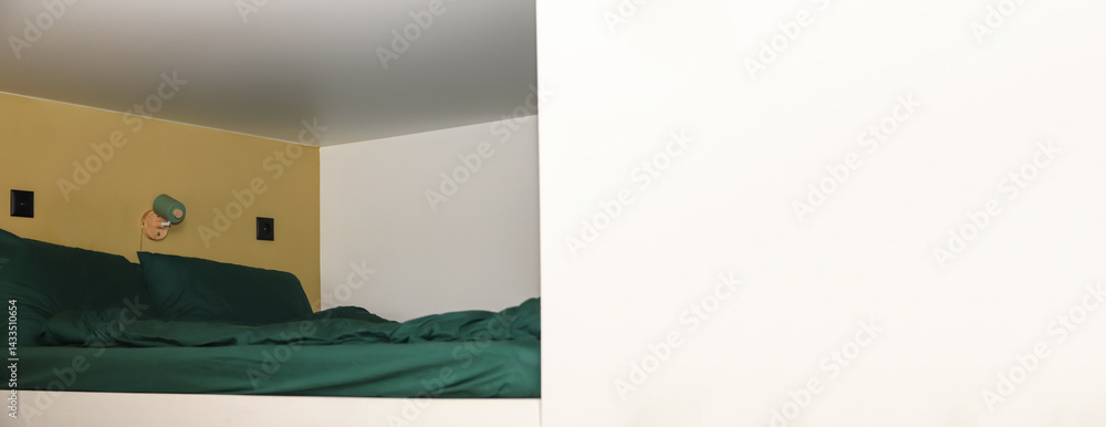 Modern loft bunk bed in white, smart space design with green lamp, wall accents, and ample copy space. Smart design concept