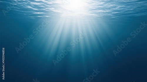 Obraz na płótnie Underwater view of sunlight penetrating ocean surface creating a serene and tranquil atmosphere. w salonie