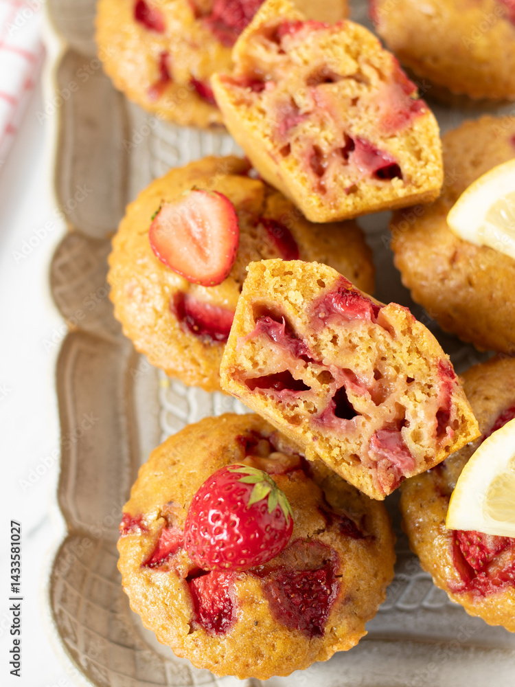 Homemade strawberry lemon muffins on rustic plate. Top view. Homemade strawberry lemon muffins on rustic plate. Top view.