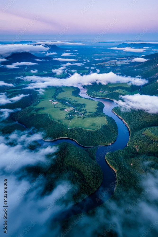 Misty River Winding Through Mountainous Landscape
