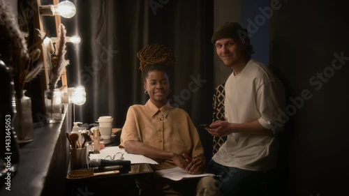 Wallpaper Mural Portrait shot of two stand-up artists smiling and looking at camera, waiting to go on stage in dimly lit dressing room Torontodigital.ca