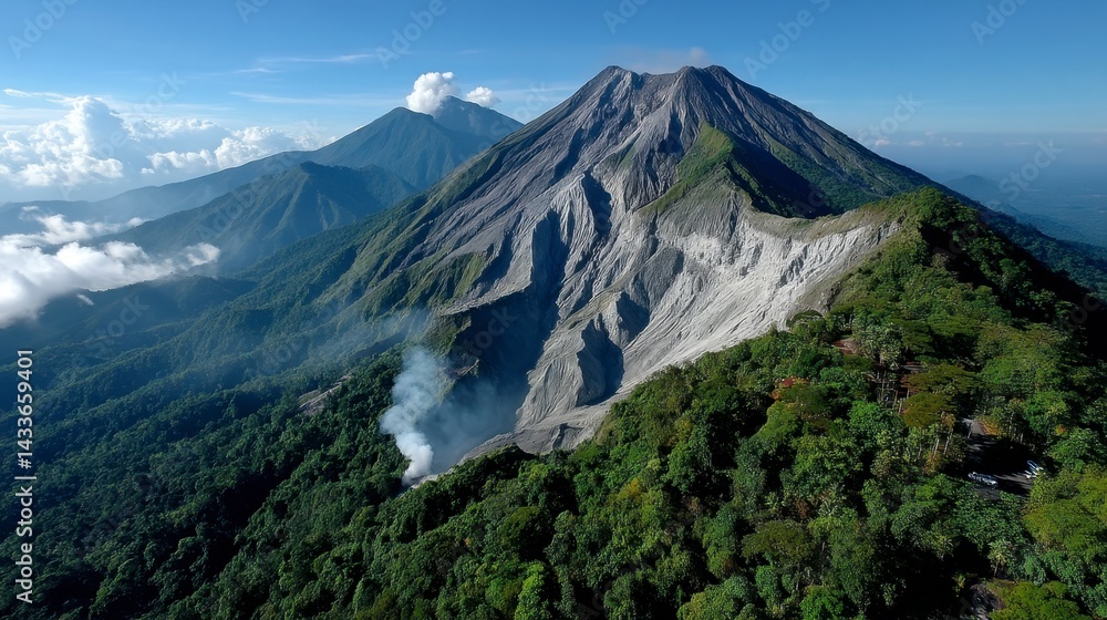 Naklejka premium Volcanic landscape with lush green slopes and a rocky summit under a bright sky. A hint of smoke rises from the crater.