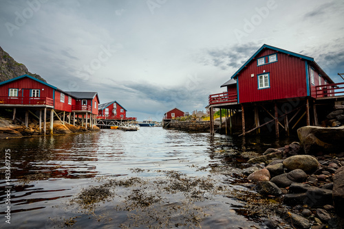 Experience the Charming Red Cabins by the Water within Norways Abundant Scenic Landscape
