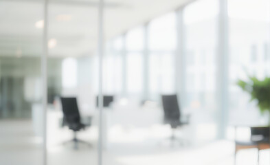 Blurred office interior with chairs desks and glass walls creating a bright space. Ultra bokeh photo without focus with a soft and warm touch of light.