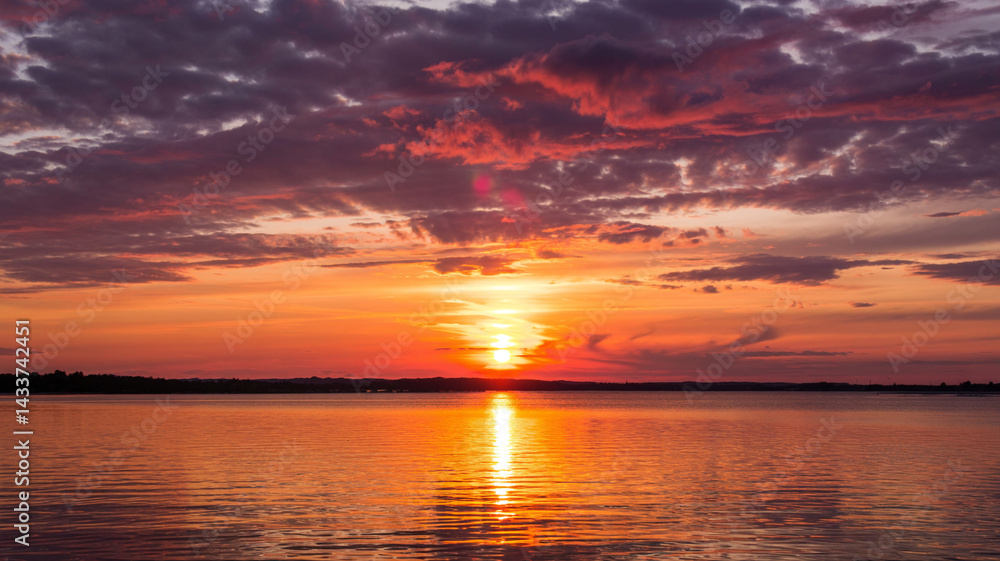 Fototapeta premium as the sunset casts vibrant colors.