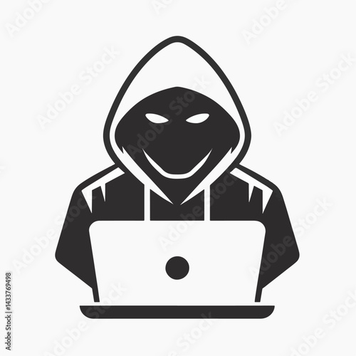 A silhouette of a hooded figure working on a laptop, representing online threats.