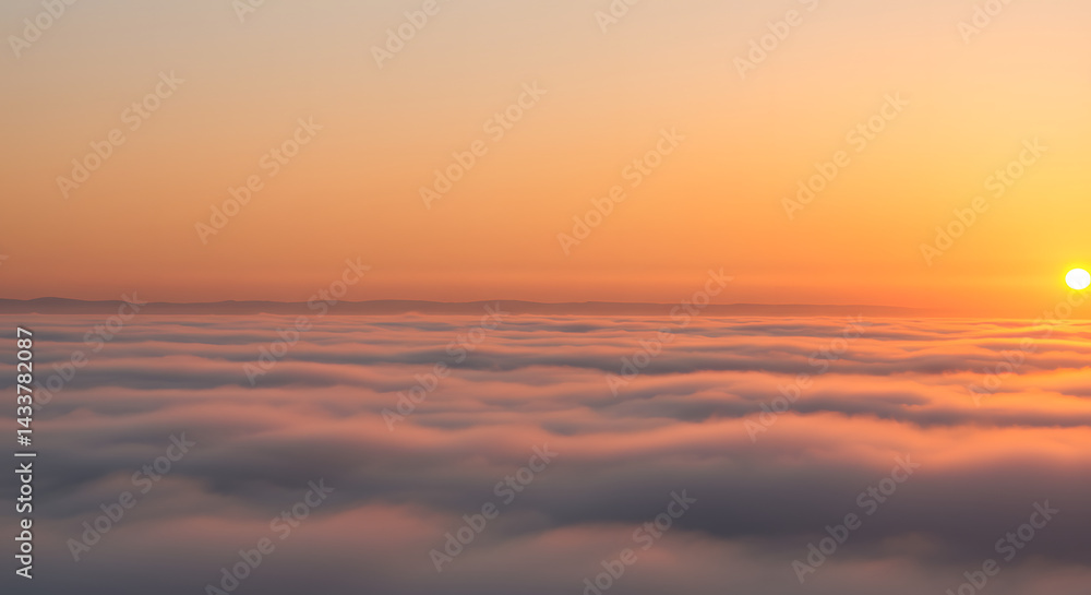 Fototapeta premium Sunrise Over Clouds with Orange Sky and Hazy Horizon