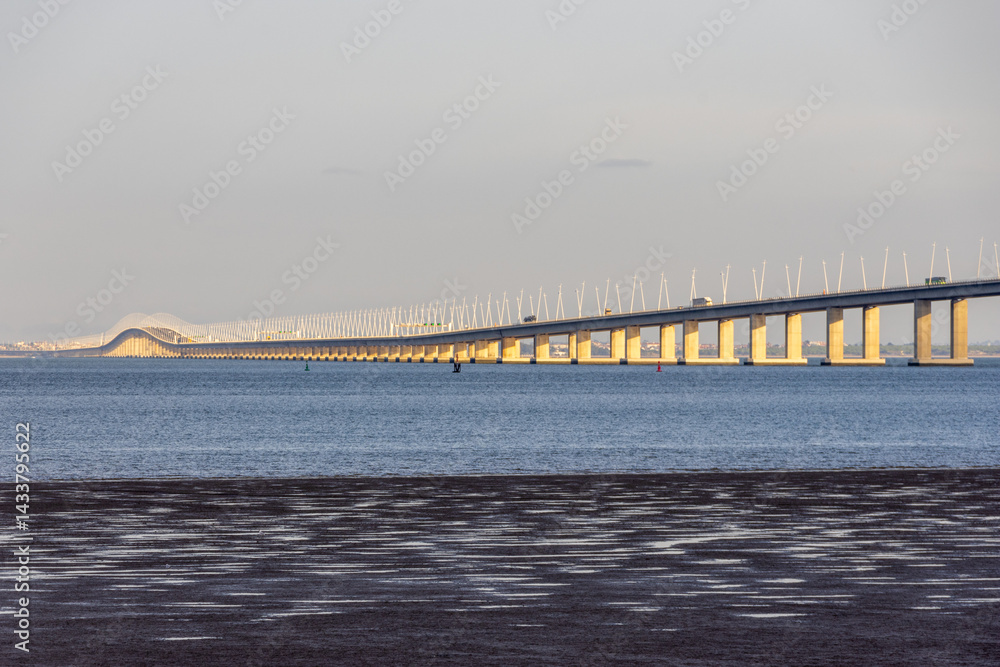 Fototapeta premium Vasco da gama bridge crossing tagus river in lisbon, portugal at sunset