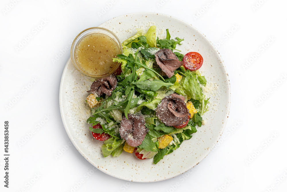 salad with beef tongue and vegetables on a white background in the restaurant salad with beef tongue and vegetables on a white background in the restaurant
