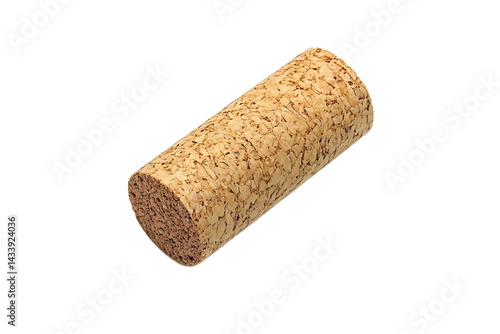 Isolated wine cork showing its texture and shape against a plain black background in the studio
