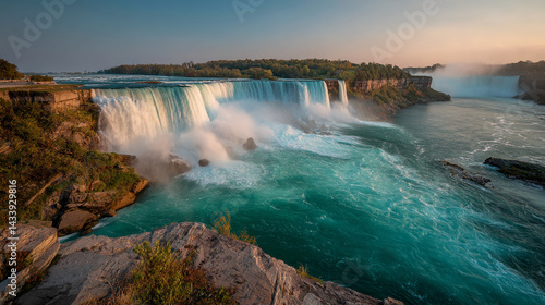 Majestic Niagara Falls at sunset, showcasing powerful water cascading over rocks, creating a breathtaking natural landscape, ideal for travel or nature-themed projects