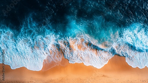 Fototapeta Naklejka Na Ścianę i Meble -  Aerial view of ocean waves crashing on sandy beach at sunset