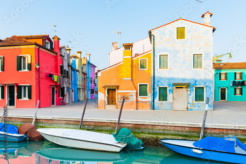 Obraz na płótnie Colorful architecture in Burano island, Venice, Italy. Boats on the canal. w salonie