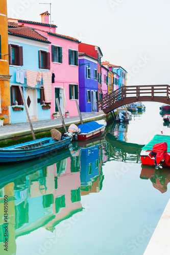 Obraz na płótnie Colorful architecture in Burano island, Venice, Italy. Boats on the canal. w salonie