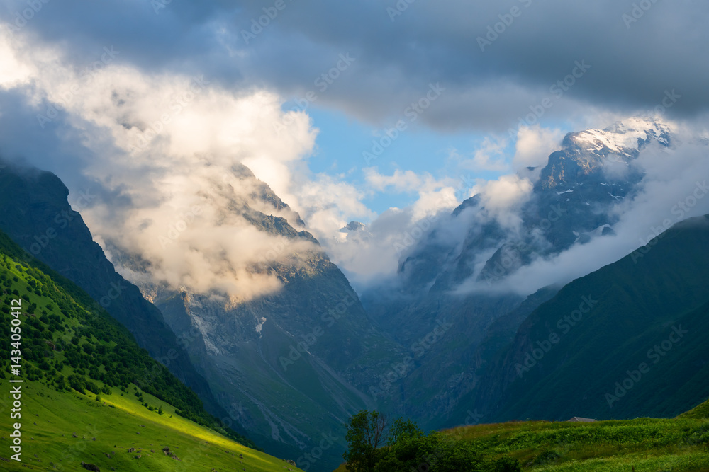 Clouds over the mountains at sunset. North Ossetia, Caucasus, Russia.