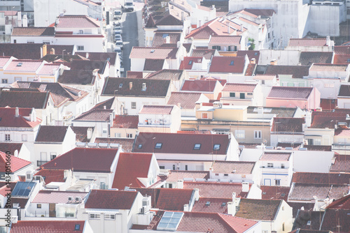 White architecture with red tile roofs on the coast of Atlantic ocean in Nazare, Portugal.