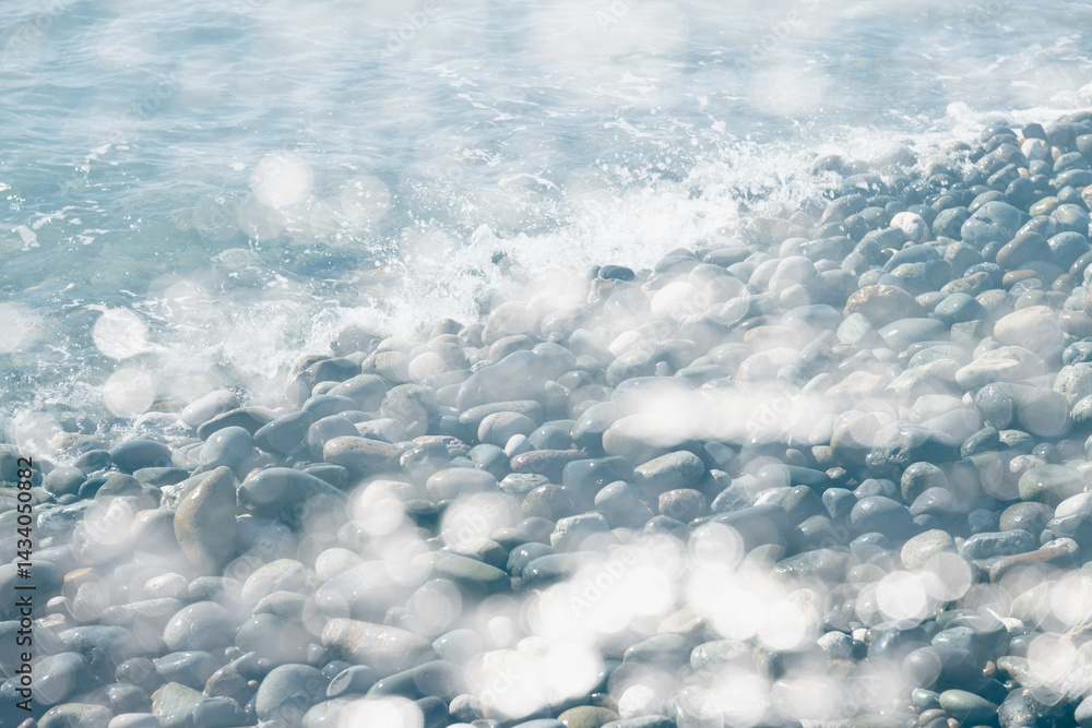 Double exposure shot of the blue sea and pebble beach at sunny day.