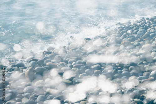 Obraz na płótnie Double exposure shot of the blue sea and pebble beach at sunny day. w salonie