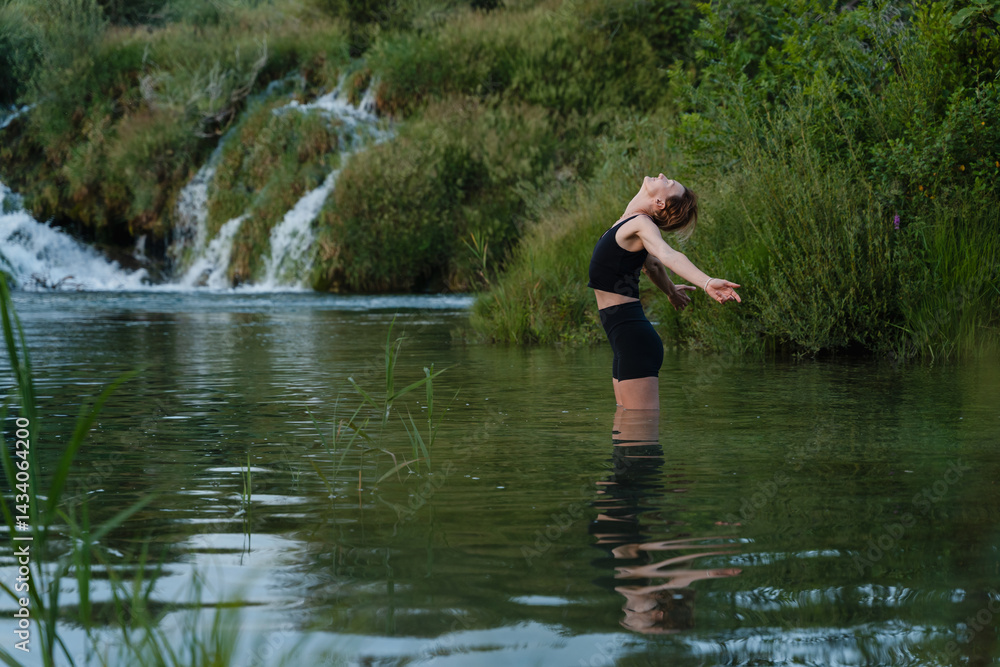 Young woman practicing yoga on nature. Holistic Health & Mental Well-Being. Young woman practicing yoga on nature. Holistic Health & Mental Well-Being.