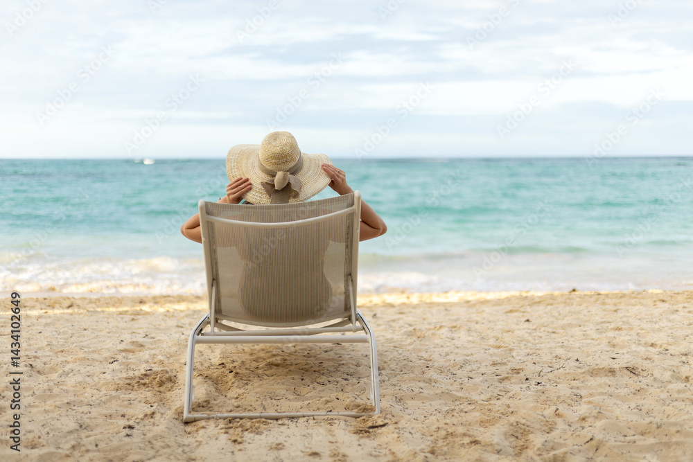 Fototapeta premium Relaxing by the seaside on a sunny day while enjoying the sound of waves and the gentle ocean breeze