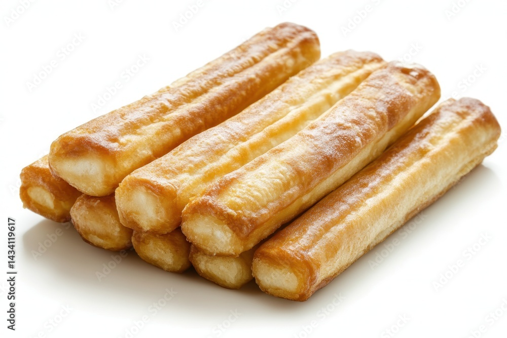 Delicious crispy churros stacked on a white surface showcasing their golden brown texture in a bright studio shot perfect for culinary themes Delicious crispy churros stacked on a white surface showcasing their golden brown texture in a bright studio shot perfect for culinary themes