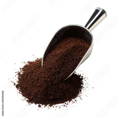 A metal scoop filled with finely ground coffee, resting on a mound of coffee grounds.