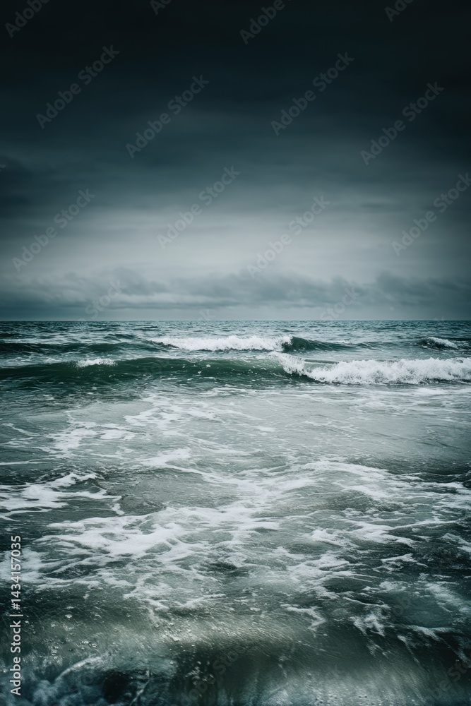 Fototapeta premium Moody ocean waves under a cloudy sky creating a serene and dramatic seascape, capturing the beauty of nature with a dark and atmospheric tone, perfect for conveying tranquility