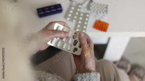 Senior woman taking her medication