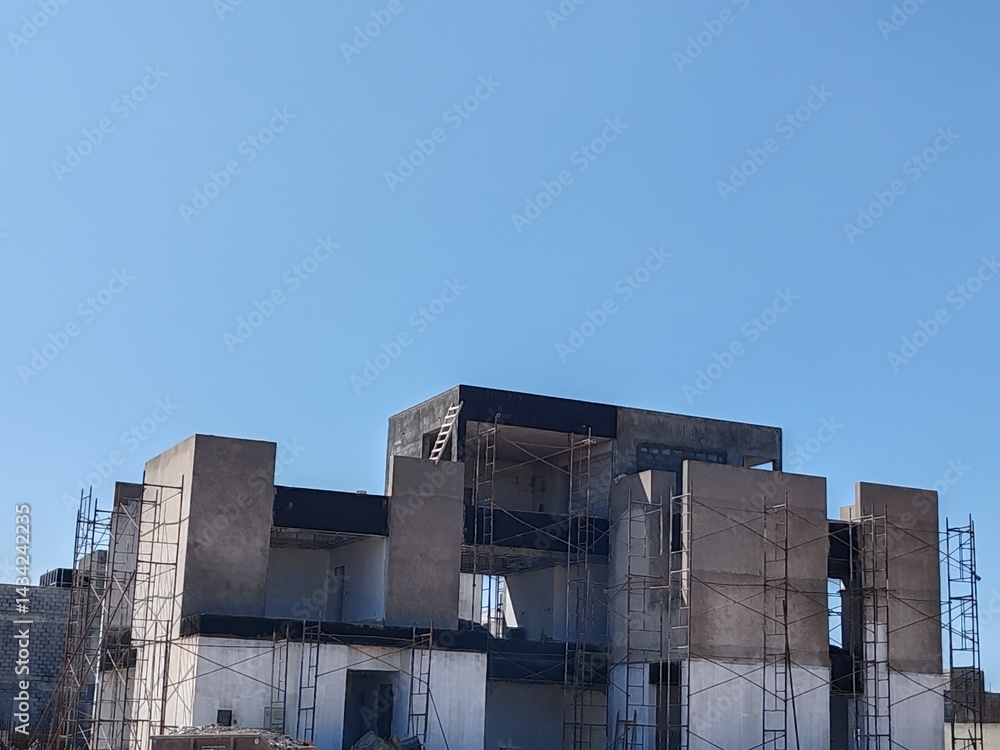 Fototapeta premium Under construction House or Villa's,Villa's with Concreate Block or bricks,Exterior view of 02 story under construction house with modern design, under construction Home or house.