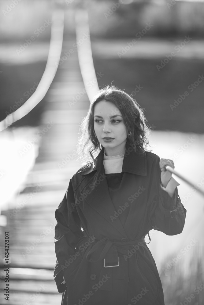 Portrait of a beautiful Asian woman with long black hair and wearing blue coat.