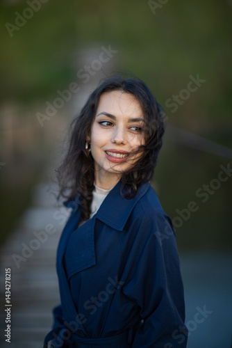 Obraz na płótnie Portrait of a beautiful Asian woman with long black hair and wearing blue coat. w salonie