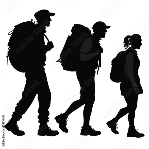 Silhouette of three hikers walking with backpacks