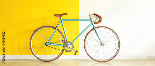 Stylish bicycle near yellow...