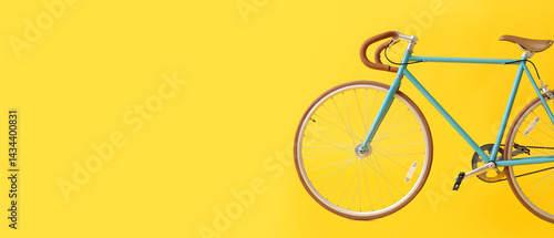 Stylish bicycle on yellow b...