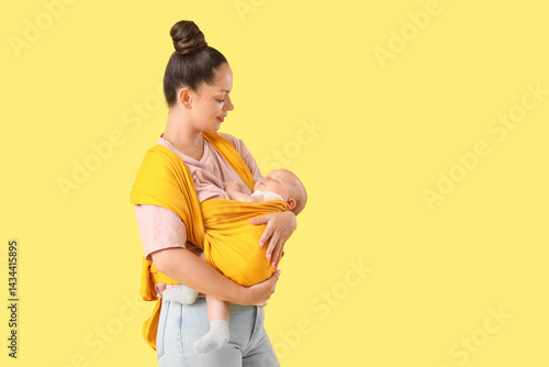Beautiful young mother with...