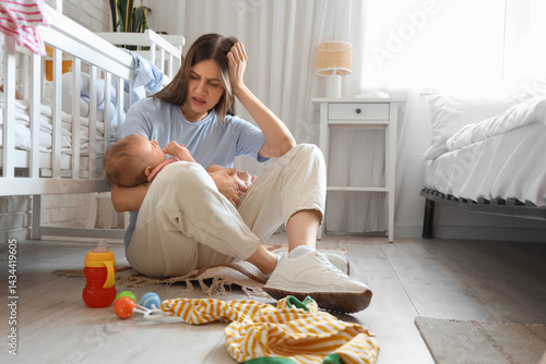 Stressed young mother suffe...