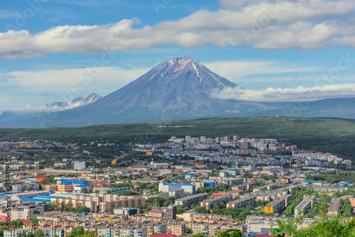 City with a volcano in the background