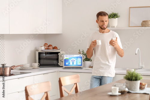 Young man with coffee cup u...