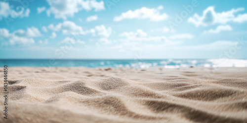 Obraz na płótnie Background with sand in the foreground and sky in the background. summer beach nature with rays of sunlight. golden sand beach. sea water against blue sky with clouds w salonie
