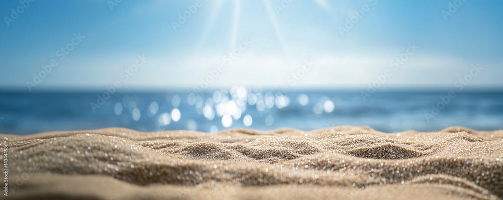 Background with sand in the foreground and sky in the background. summer beach nature with rays of sunlight. golden sand beach. sea water against blue sky with clouds