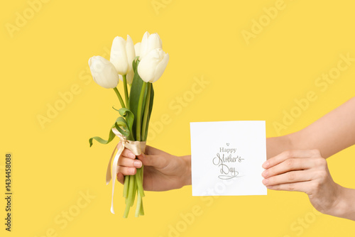 Young woman holding card wi...