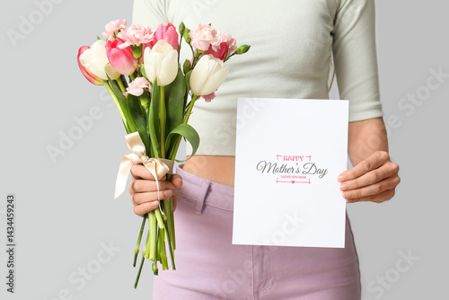 Woman holding bouquet of be...