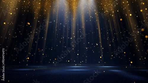 Golden particles are slowly falling on a dark blue glitter background illuminated by two spotlights, creating a magical and elegant atmosphere