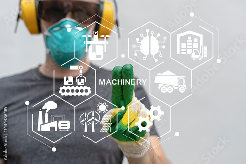 Engineer using virtual touch screen push text: MACHINERY. Machinery industry technology and robotic process automation concept. Manufacturing digital transformation, change management.