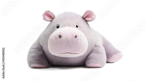 A stuffed animal of a hippo laying 