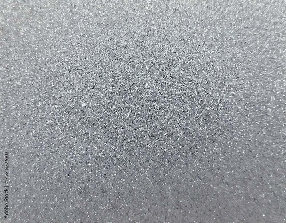 Un fondo abstracto con una textura sutil de micro puntos o motas finas en una gama de grises suaves que van desde el gris pálido hasta el gris ceniza claro. Un fondo abstracto con una textura sutil de micro puntos o motas finas en una gama de grises suaves que van desde el gris pálido hasta el gris ceniza claro.