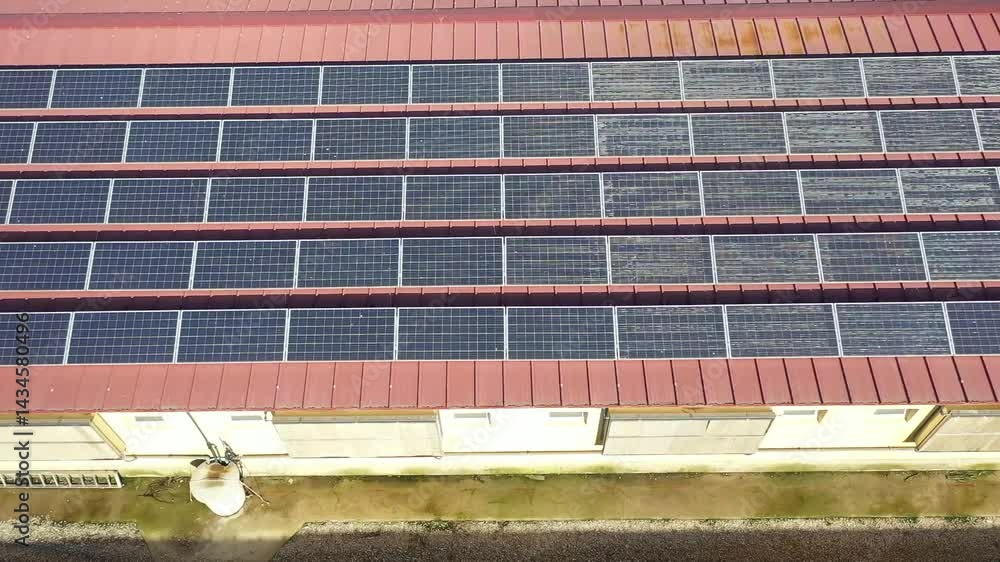 Vidéo Stock Rows of solar panels are installed on a red metal roof ...