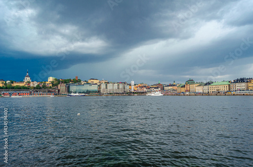 Urban scene in Stockholm, Sweden with storm clouds in the background