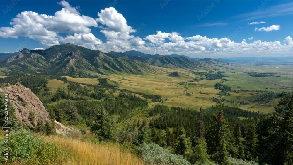 Panoramic vista of rolling green mountains and valleys under a bright blue sky with fluffy white clouds in scenic landscape Panoramic vista of rolling green mountains and valleys under a bright blue sky with fluffy white clouds in scenic landscape